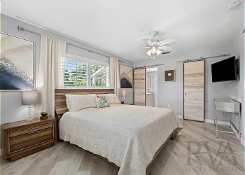 Master bedroom at Hy-Tee vacation rental featuring king bed and natural lighting